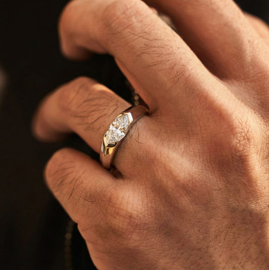 Marquise east-west solitaire gold-plated ring worn on the finger of a man